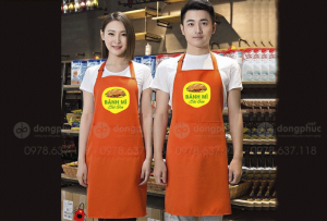 May và in tạp dề màu cam Quán Bánh mì Sài Gòn