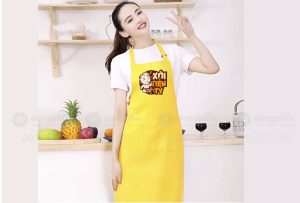 May và in tạp dề màu vàng Quán Xôi tiền tỷ